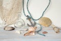 Sea Ã¢â¬â¹Ã¢â¬â¹shells, blue cord, white fishing net, starfish, pebbles, still life, summer vacation concept, trip to warmer climes, Royalty Free Stock Photo